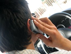 Man talking on cell phone in a car